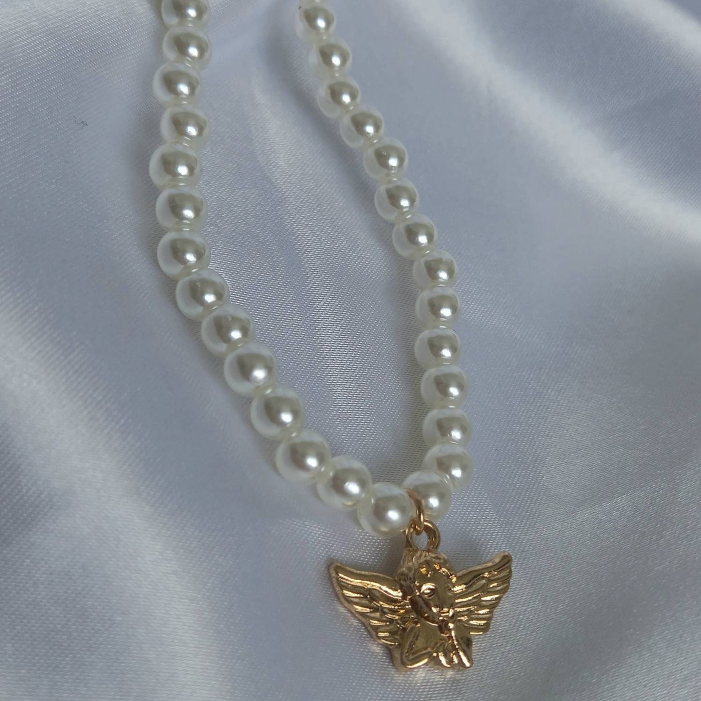 Gold Angel Charm Pearl Necklace - Faux Pearl Necklaces In The UK,Gold Angel Necklace,Angel Jewellery,Gold Jewellery In The UK,Gold Necklace
