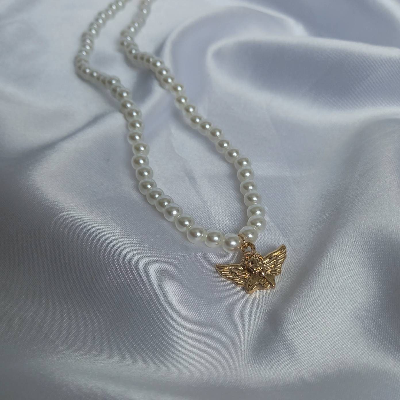 Gold Angel Charm Pearl Necklace - Faux Pearl Necklaces In The UK,Gold Angel Necklace,Angel Jewellery,Gold Jewellery In The UK,Gold Necklace