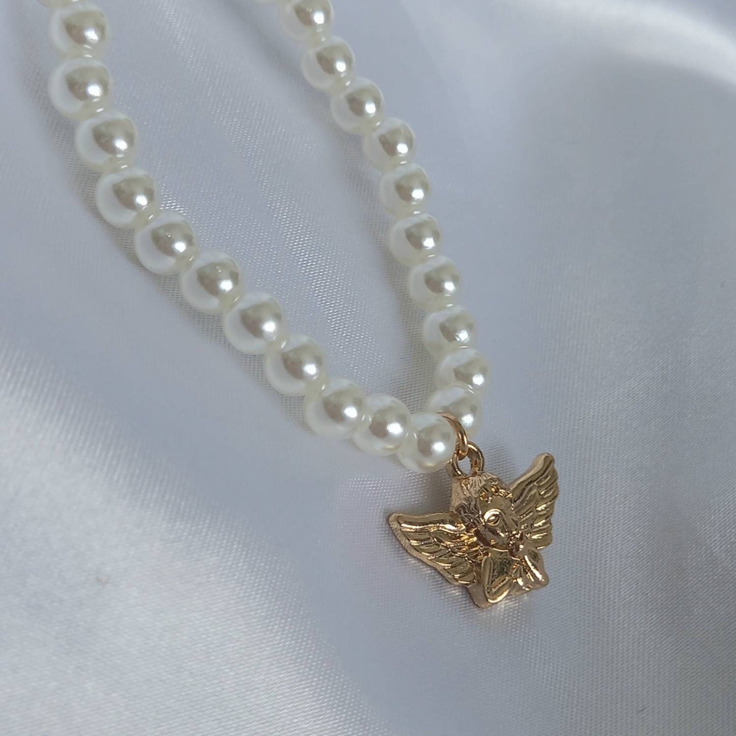 Gold Angel Charm Pearl Necklace - Faux Pearl Necklaces In The UK,Gold Angel Necklace,Angel Jewellery,Gold Jewellery In The UK,Gold Necklace